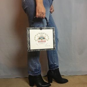 Retro Romeo Roma cigar box handbag.